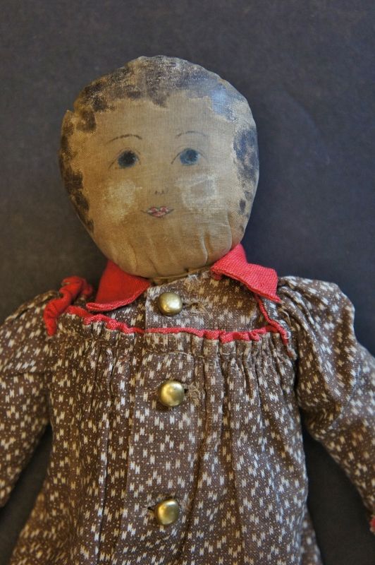 A tiny adorable 11&quot; babyland rag doll, brown calico dress Circa 1890