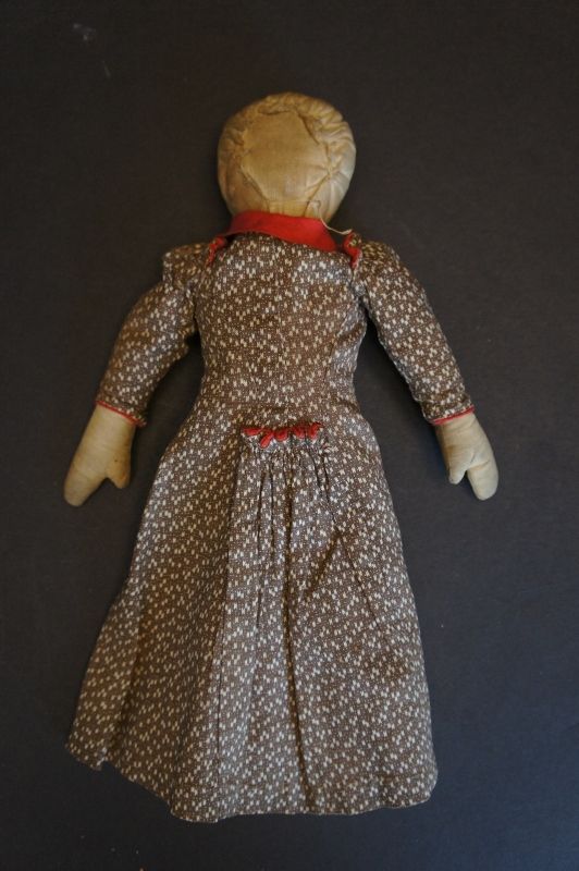 A tiny adorable 11&quot; babyland rag doll, brown calico dress Circa 1890