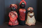 Three old black bottle doll doorstops 1900-1930