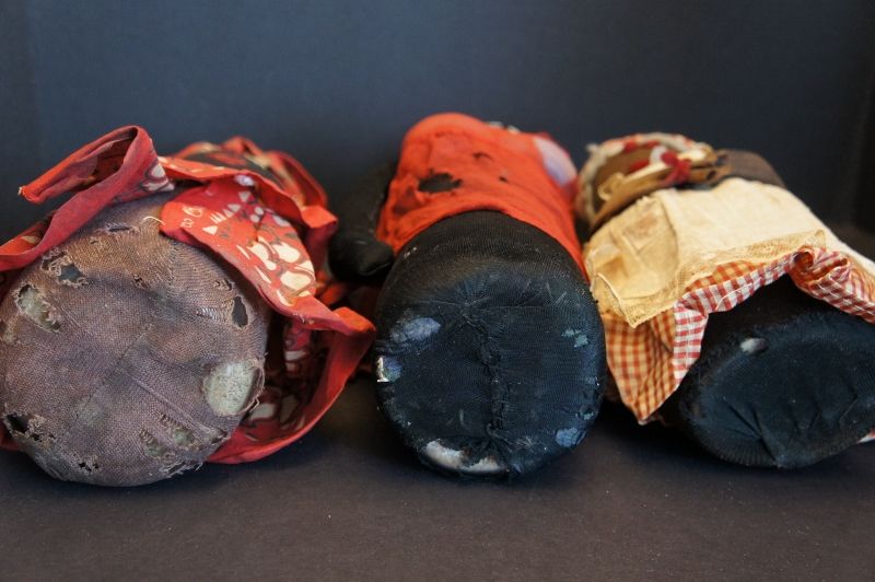 Three old black bottle doll doorstops 1900-1930