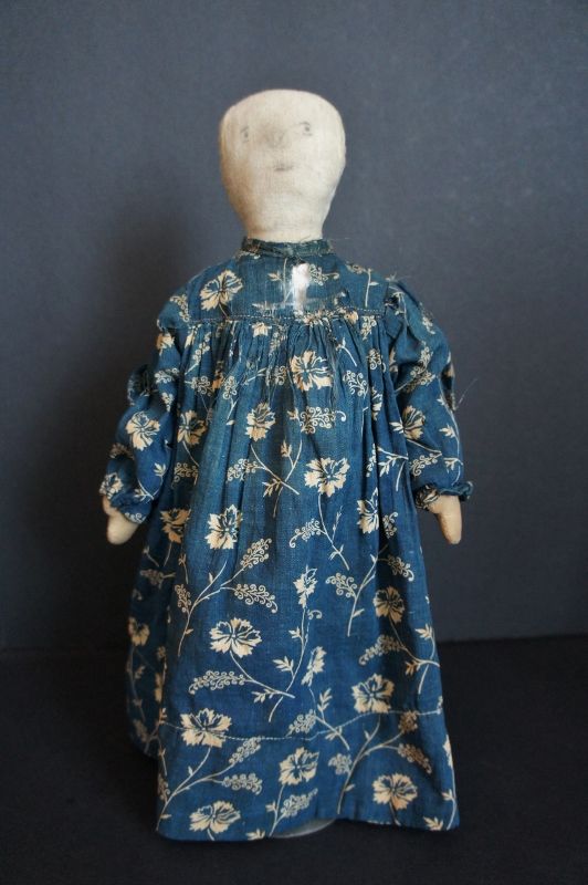 Plain and simple pencil face doll with blue calico dress