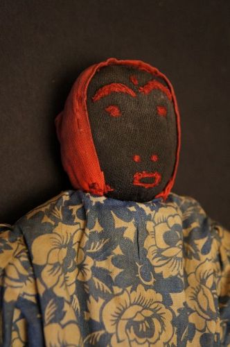 8" black doll with great little suprised face all original