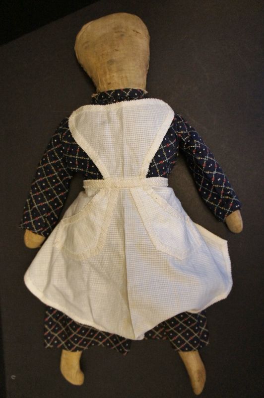 Pencil face cloth doll with a little o for a mouth, a country doll