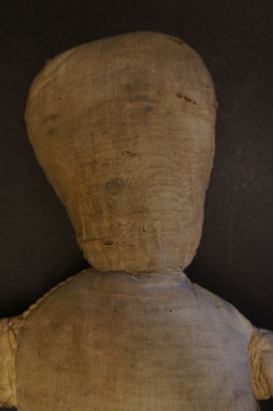 Pencil face cloth doll with a little o for a mouth, a country doll