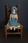 Amazing squeak toy doll in original dress  bisque head glass eyes 11"