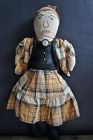 Tooty is 11" tall with an embroidered face and sewn on clothes C.1930