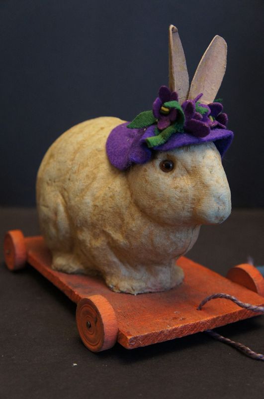 Pull toy rabbit in a purple hat