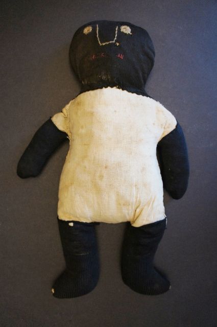 Very graphic simplistic black cloth doll heavy rag stuffed folky
