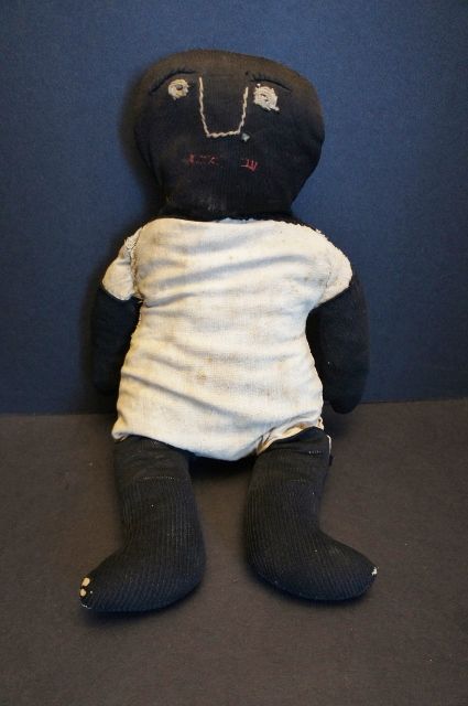Very graphic simplistic black cloth doll heavy rag stuffed folky