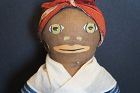 15" Painted face black cloth doll blue calico dress C. 1920