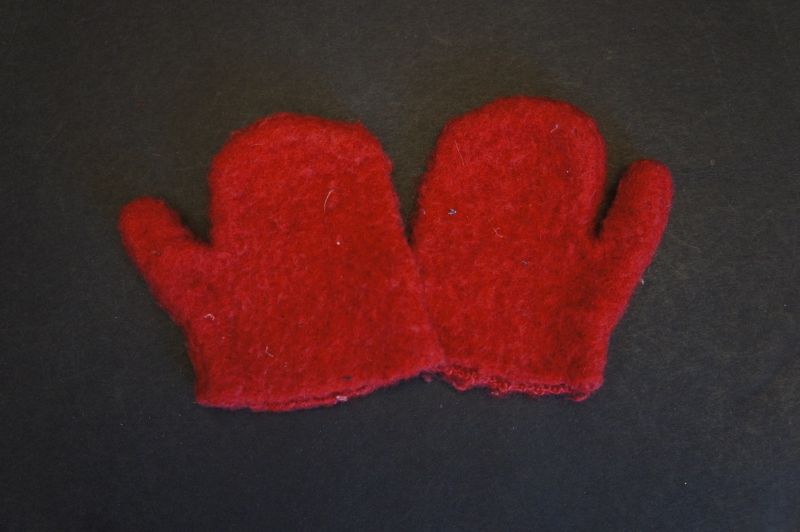 Very small child's first mittens, red wool hand sewn
