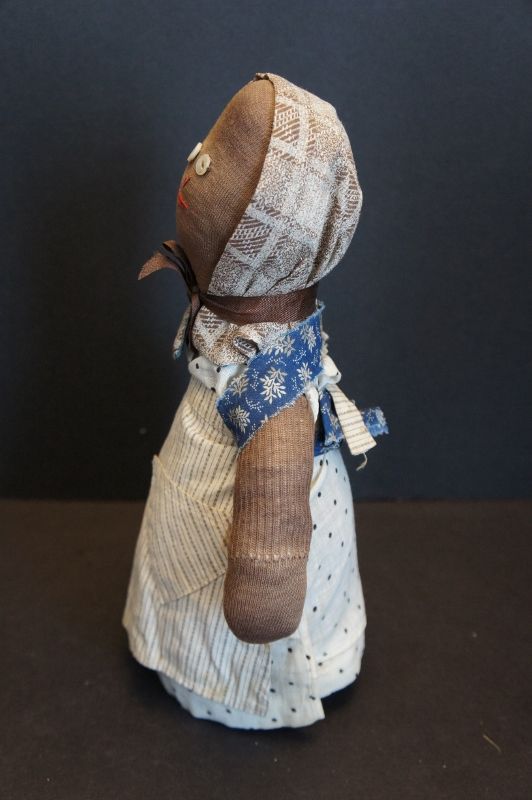 Sweetness and life is this small bottle doll doorstop 12&quot;