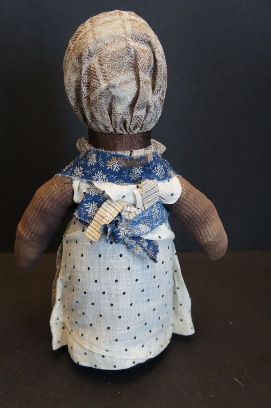 Sweetness and life is this small bottle doll doorstop 12&quot;