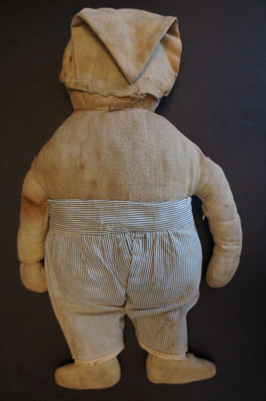 A little sweet tuffy, happy embroidered face doll striped pants C.1900