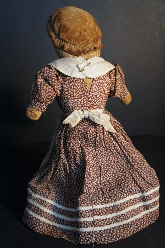 C. 1900 stockinette stump doll with brown calico dress. 14&quot;
