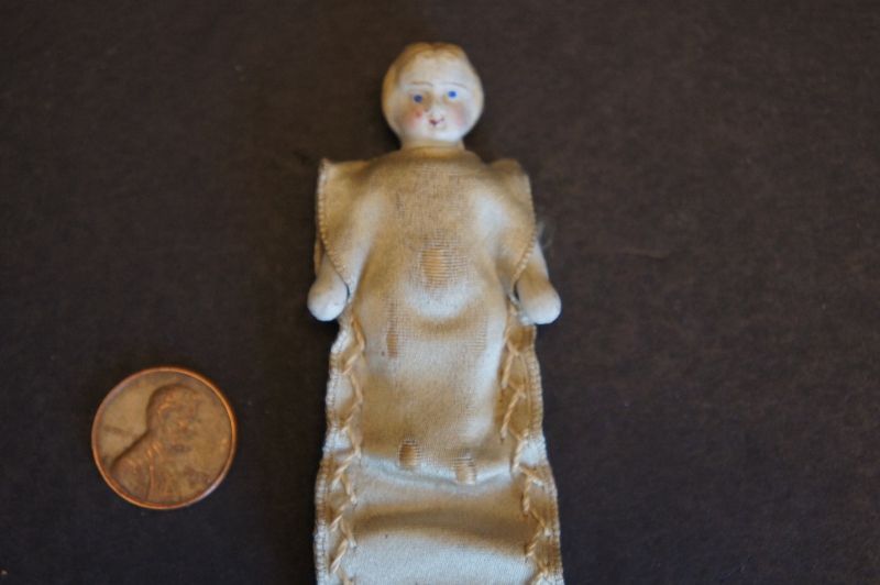 Tiny bisque doll needle keep tan satin with embroidered edge C 1880