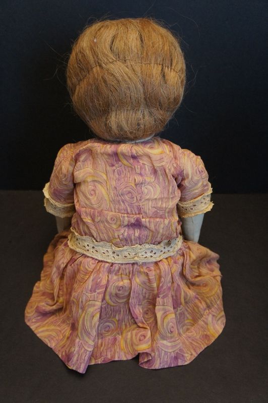 A very special doll 22&quot; with drawn face raised nose great hair C.1900