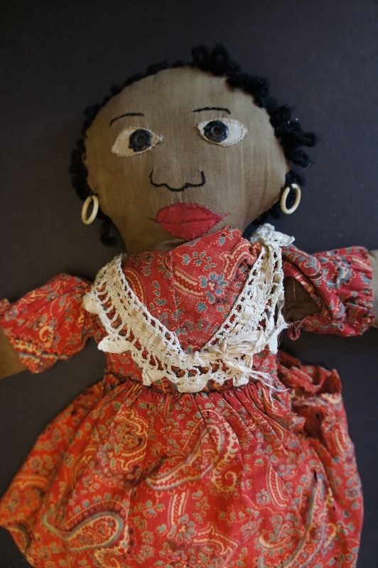 Sweet little black doll that has early snaps for eye and fancy legs