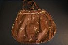 Brown calico 19th C. bag with a linen lining 10" by 13"