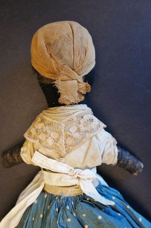 Dear 19th C.little black doll hand sewn great folky face. 17&quot;