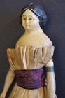A 6 1/2" milliner's model doll with origina clothes C.1860