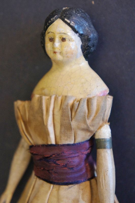 A 6 1/2&quot; milliner's model doll with origina clothes C.1860
