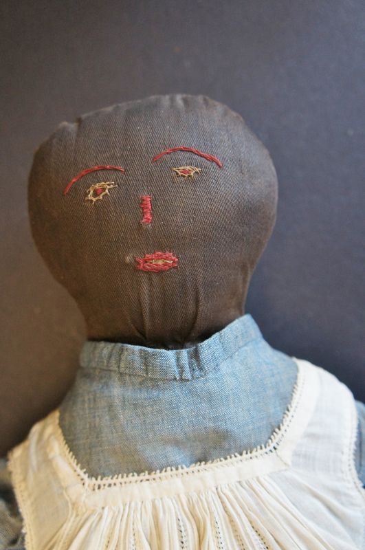a special black cloth doll with the nicest face with a hint of sadness