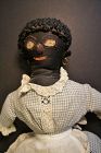 Early black cloth doll with a spectacular face 17"