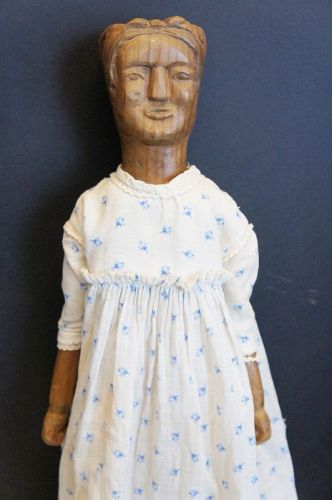 Wouldn't you like to eat dinner at her house!  Carved wooden doll