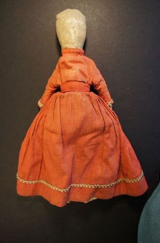 A very dear little doll made with a corncob body  12" handsewn C. 1870