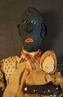 Aa touching black doll holding a white baby 12" C. 1890