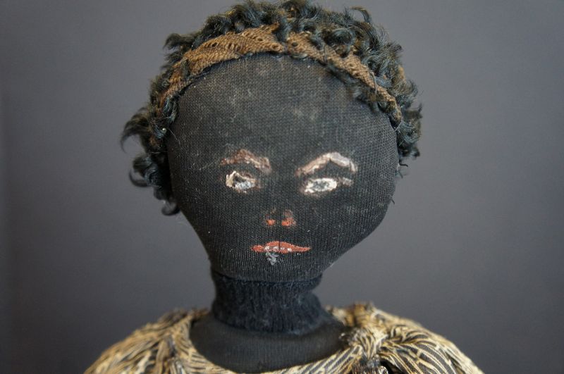 an unpretentious  black cloth doll with a great painted face 17&quot; 1880