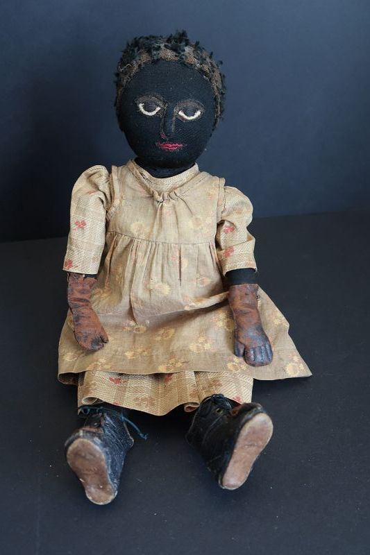The best as found black cloth doll, leather hands, applied nose 17&quot;