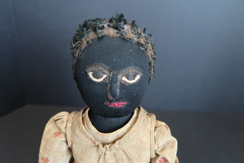 The best as found black cloth doll, leather hands, applied nose 17&quot;