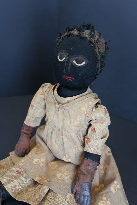 The best as found black cloth doll, leather hands, applied nose 17&quot;