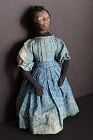 Fascinating black doll, leather over a carved wooden head,  1840'