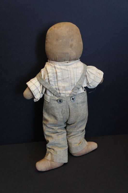 A little fellow, plump and sturdy with his favorite overalls 14&quot;