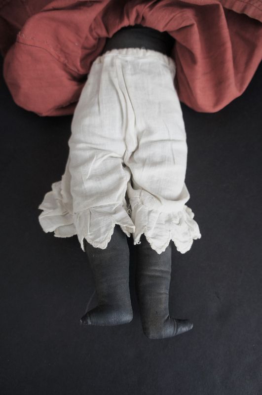 Seen a lot of happy years, black cloth doll /great old red dress C1890