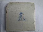 A Dutch delft tile c.1700 depicting a man playing colf.