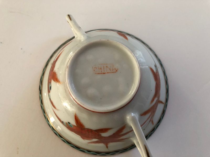 A Chinese porcelain hand painted cup, saucer and cover c.1920