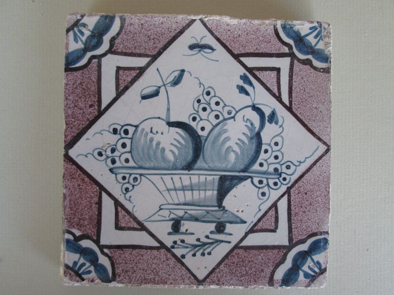 Set of 12 delft tiles of fruit basket with manganese ground c. 1750