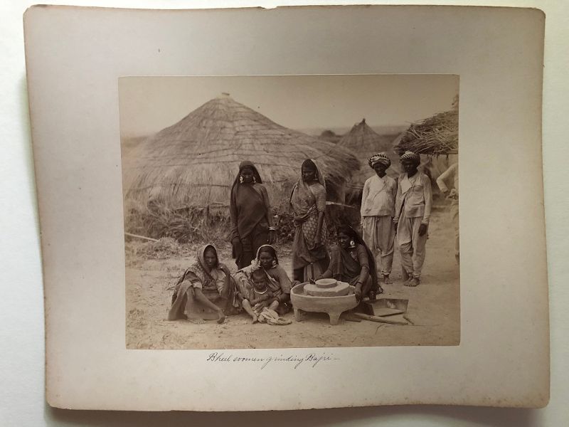 Albumen photo of people outside thatch houses, India c.1880