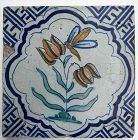 Delft polychrome tile with flowers and bee 1st half 17th century