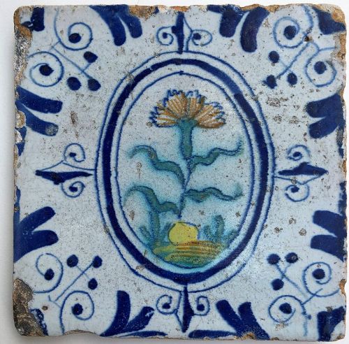 Dutch delft polychrome tile of a carnation 1st half 17th century