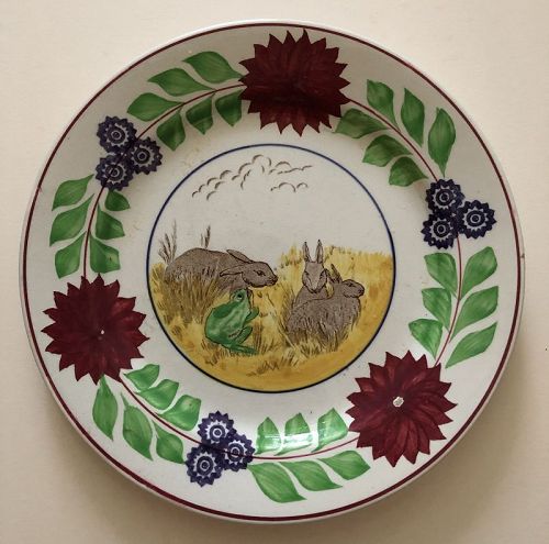 Staffordshire ironstone plate with rabbits a frog and flowers, c. 1900
