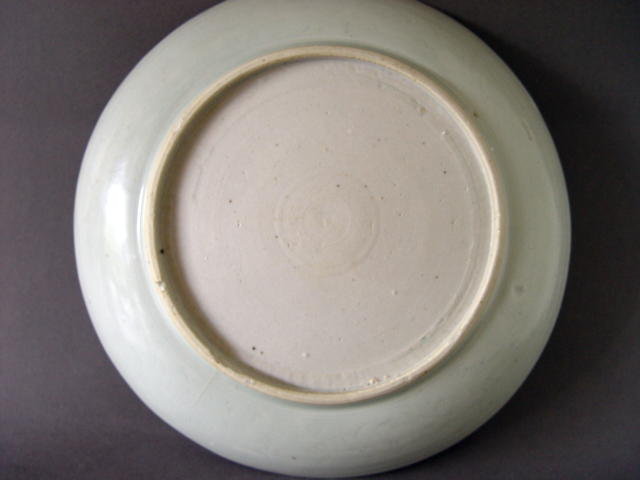 A rare,large Ming white glazed dish with incised decor