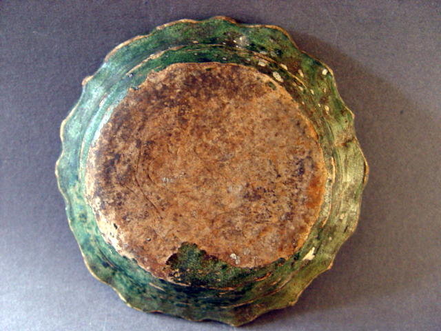 An extremely rare late Yuan molded Sancai glazed dish