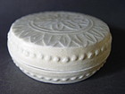 A very nice molded " White Song " covered box