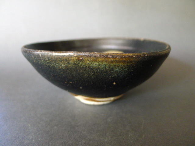 A Song black glazed Jizhou tea bowl with Prunus pattern