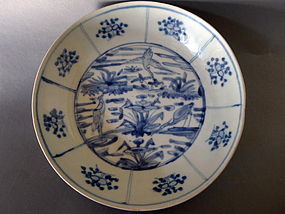 A Ming Swatow deep blue and white dish with cranes